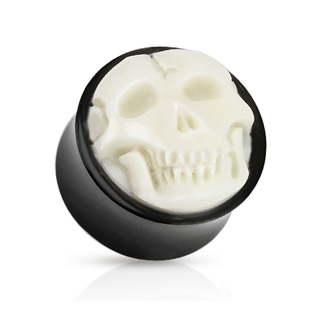 Plug de chifre e uma caveira de osso
